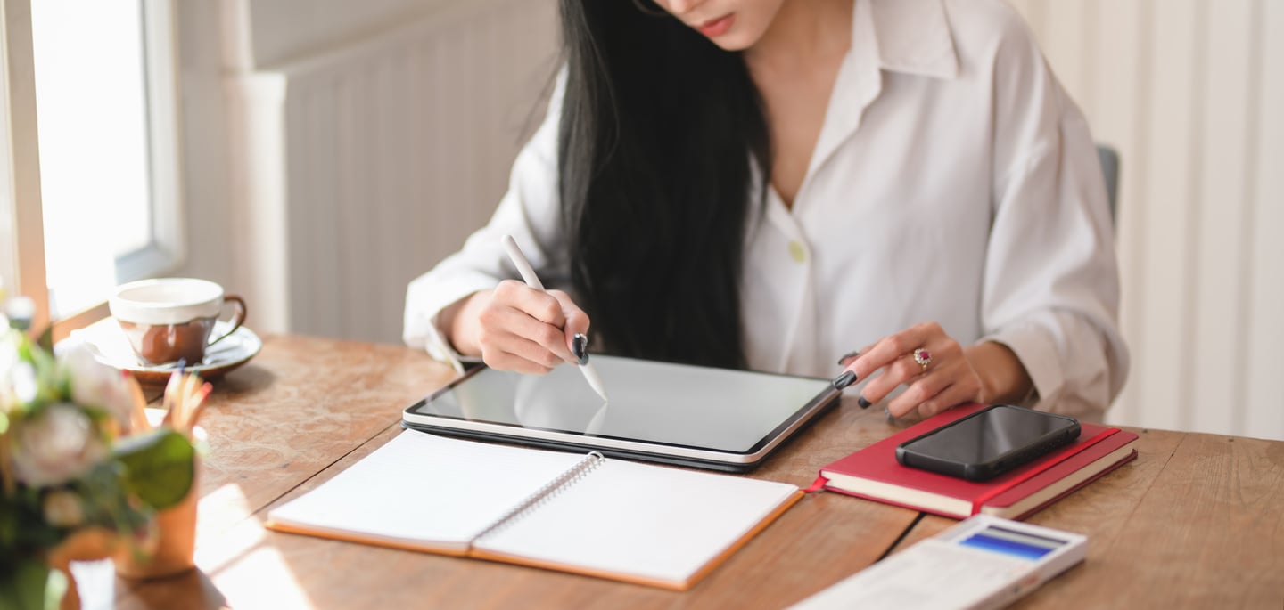 Person Writing on Tablet Computer